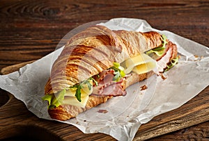 Croissant sandwich with cheese and ham