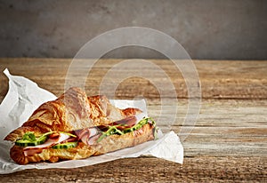 Croissant sandwich with ham and cucumber