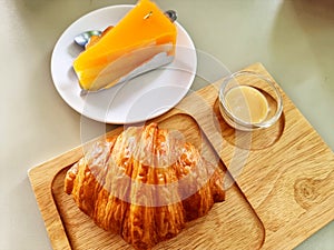 The croissant with sweetened condensed milk and Orange cake