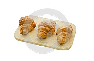 Croissant on wood board