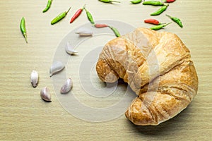 Croissant on woonden table