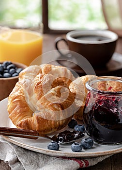 Croissants with blueberry jam and blueberries