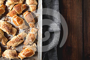 Croissants with chocolate on baking tray