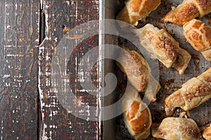 Croissants with chocolate on baking tray