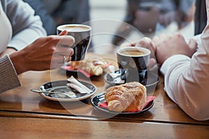 Croissants and coffee, french breakfast in cafe in Paris