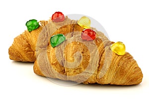 Croissants with colorful conserved fruits photo