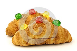 Croissants with colorful conserved fruits photo