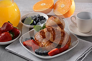 Croissants, fresh and dried fruits, fresh juice