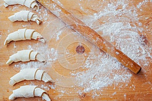 croissants with jam on a wooden board