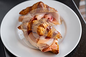 Croissants with parma ham. Delicious croissant sandwich