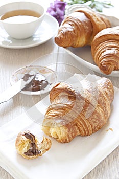 Croissants on table with chocolate