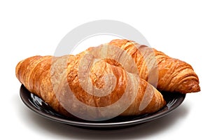 Croissants on a white background close-up. Homemade baking