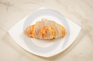 Croissants in a white plate/croissants in a white square plate o