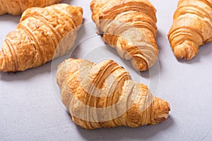 Croissants on wooden background