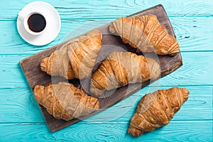 Croissants on wooden background