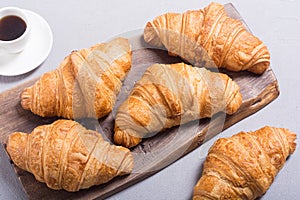 Croissants on wooden background