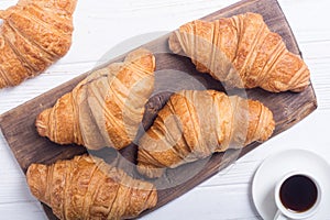 Croissants on wooden background