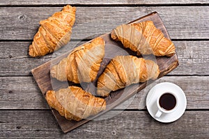 Croissants on wooden background