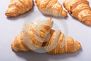 Croissants on wooden background