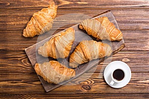 Croissants on wooden background