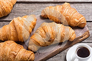 Croissants on wooden background