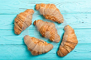 Croissants on wooden background