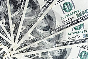 Crolled stack of 100 dollar bills, close up banknote