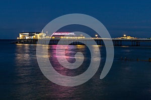 Cromer pier in Norfolk at night.