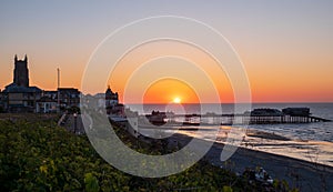 Cromer town and pier at sunset
