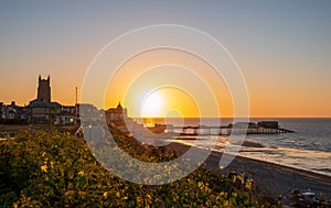 Cromer town and pier at sunset