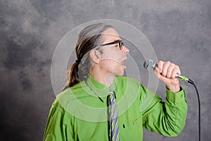 Crooner in green shirt and necktie