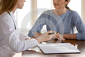 Close up of female doctor consult woman patient photo