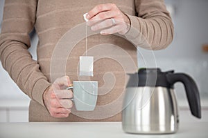 crop close up relaxed man holding mug tea