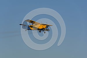 Crop duster spraying crops from the air in the morning light