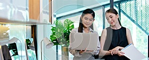 Crop image banner size, Female office person working with laptop meeting in workplace. Two businesswomen happy success connection