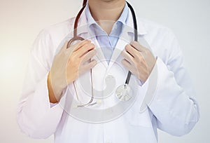 Crop image of professional confident young female asian doctor in white coat, stethoscope over neck