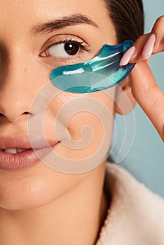 Crop macro shot of woman with eye patches