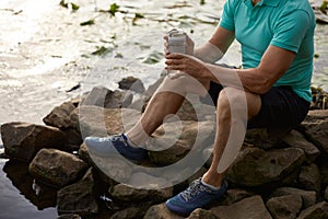 Crop of old mature sportsman enjoying beautiful wild nature after morning jog