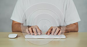 Crop picture of hand man typing white keyboard. Freelance business man search engine or using chat gpt technology AI for working photo