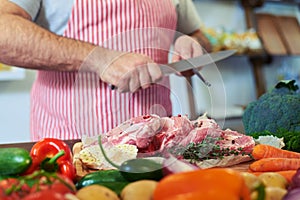 Crop shot of hands sharpen knife before preparing meat