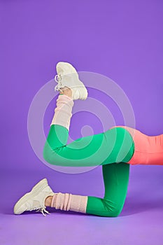 Crop shot of unrecognizable fitness woman doing leg lifts