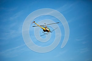 Crop sprayer duster helicopter, spraying mountains, fields and l