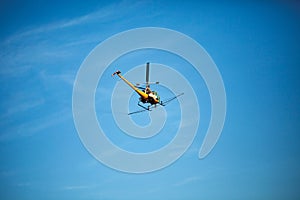 Crop sprayer duster helicopter, spraying mountains, fields and l