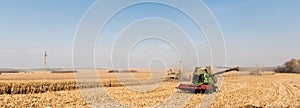 Crop of tractors on golden field