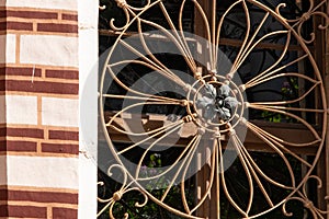 Crop view of architecture detail - antique wrought iron window