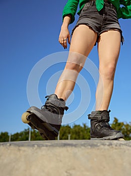 Crop view of teenager girl on roller skates