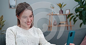 Crop view of woman having video call and showing with with deaf-mute sign language phrase I love you. Cheerful female