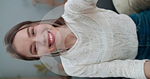 Crop view of young female person having video call and using smartphone frontal camera. Happy woman smiling and saying