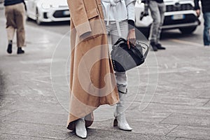 Crop woman with bag om street