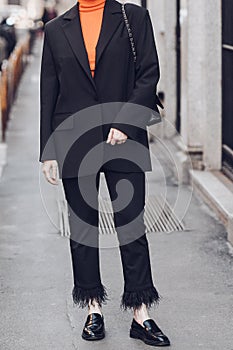 Crop woman in black suit